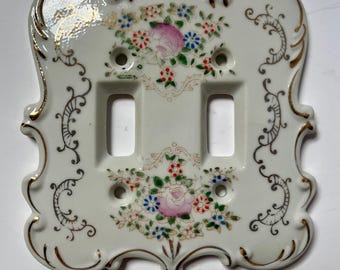 Plaque d'interrupteur vintage en céramique à motif floral