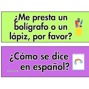 May include: Two colourful signs with Spanish phrases. The top sign is green and says "&iquest;Me presta un bol&iacute;grafo o un l&aacute;piz, por favor?" with a drawing of a cup of pens. The bottom sign is purple and says "&iquest;C&oacute;mo se dice ____ en espa&ntilde;ol?" with a drawing of a notebook with a rainbow.