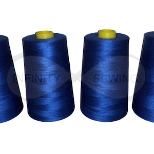 May include: Four spools of blue sewing thread. The spools are arranged in a row, with the yellow plastic tops facing the viewer.