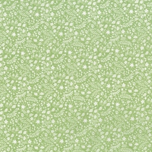 May include: A seamless green fabric with a white floral pattern. The pattern features small flowers, leaves, and vines.