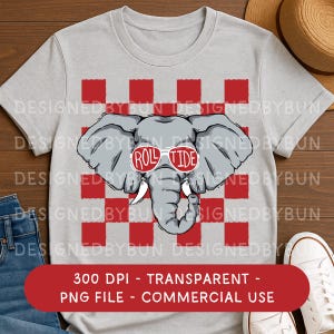 May include: A light gray t-shirt featuring a gray elephant wearing red sunglasses with the text "ROLL TIDE". The elephant is set against a red and white checkered background. The shirt has short sleeves.