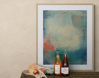 May include: Two glass bottles of wine, one with a pale yellow liquid and the other with a pink liquid, are on a wooden table. A white mesh bag with fruit is in the foreground. A framed abstract painting with blue, green, and orange colours hangs on the wall behind the bottles.