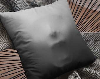 May include: A gray and black pillow with a gradient design. The pillow is made of a soft, comfortable fabric and has a subtle texture.