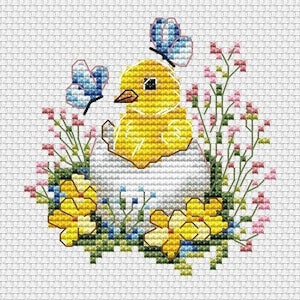 May include: A yellow chick with blue butterfly wings sits in a white egg surrounded by yellow flowers and green leaves.