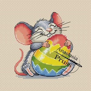 May include: Cross-stitch design of a smiling gray mouse hugging a colorful Easter egg. The egg features a rainbow design with blue, green, yellow, and red sections. The text "Anastasia Pruss" is on the egg.