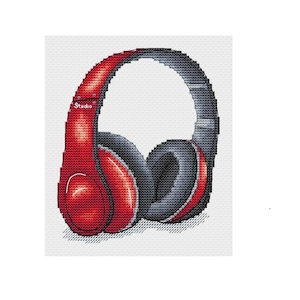 Könnte beinhalten: Rote und schwarze Over-Ear-Kopfhörer mit dem Schriftzug "Studio" an der Seite.