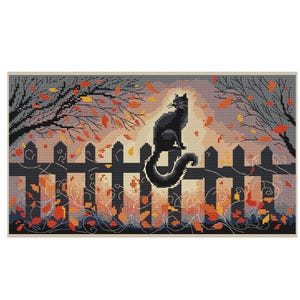 May include: A cross-stitch design featuring a black cat perched on a black picket fence. The background shows a sunset with autumn leaves and bare trees. The color palette includes orange, yellow, and black.