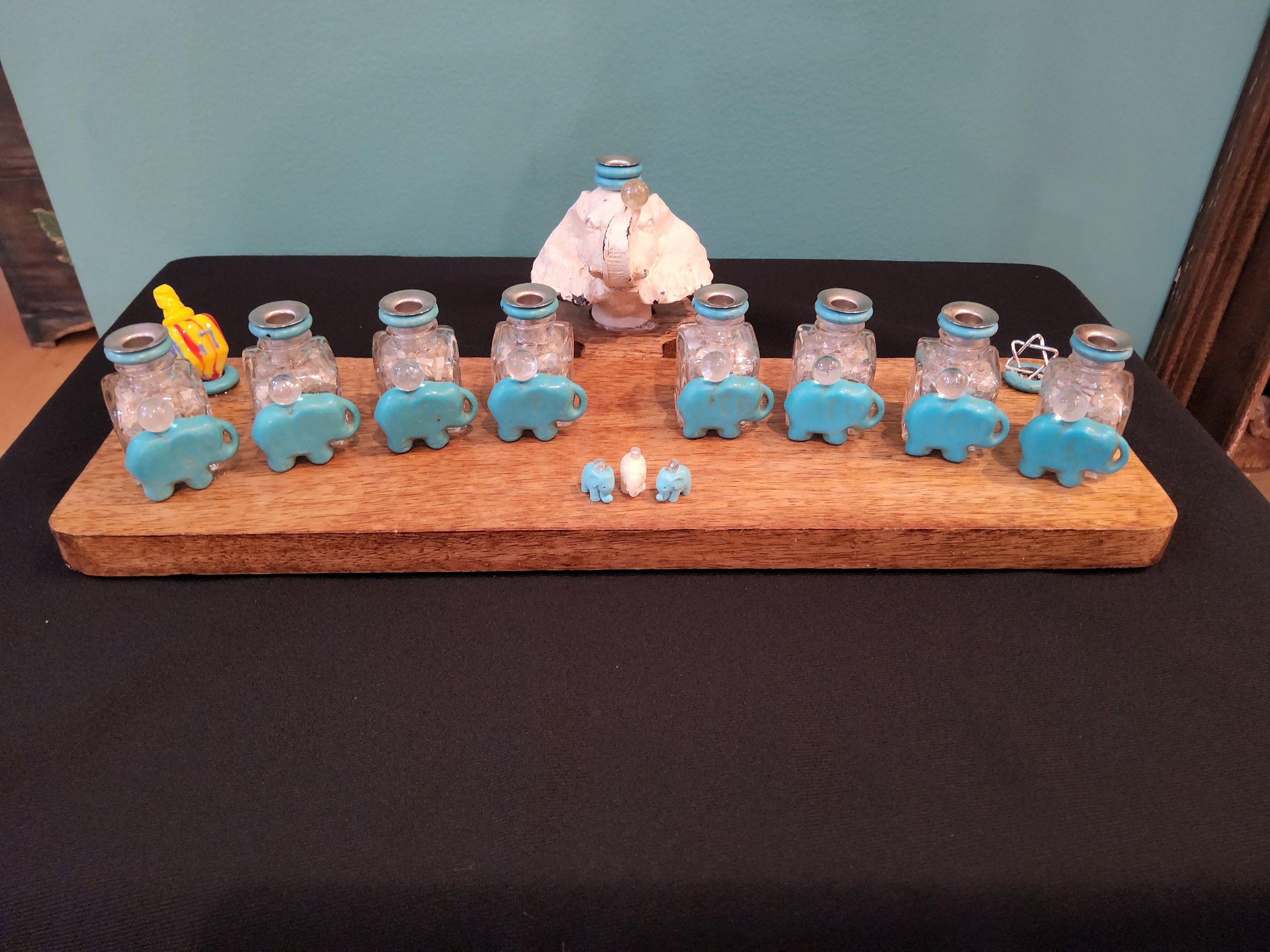 Turquoise Elephant Menorah. Lucky Elephants Light the Way for Hanukah
