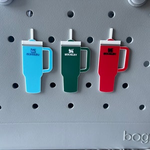 3 stanley tumbler charms shown on the front of an orignal bogg bag for size and style reference.