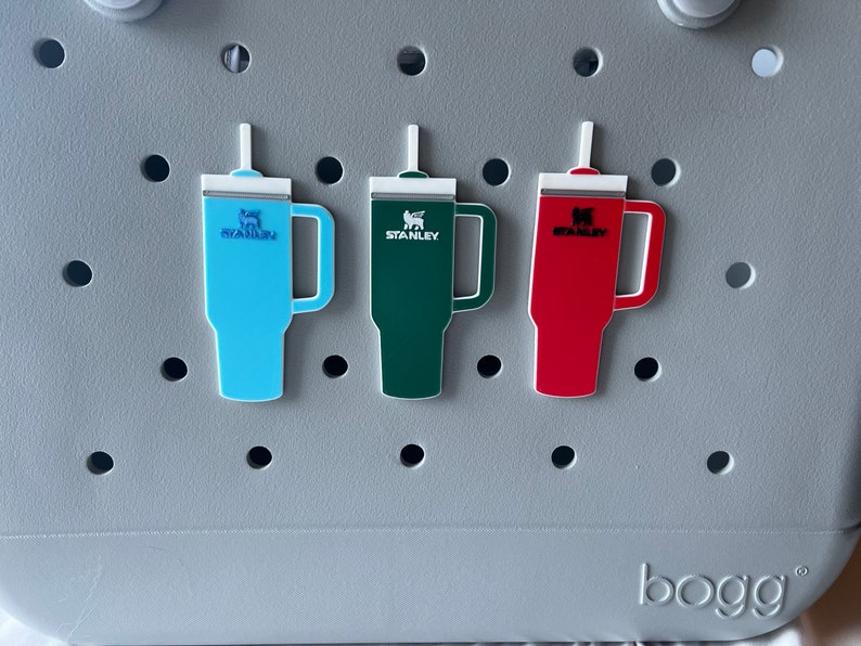 3 stanley tumbler charms shown on the front of an orignal bogg bag for size and style reference.
