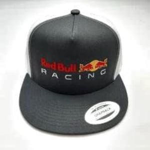May include: A gray and white trucker hat with a red and yellow Red Bull Racing logo embroidered on the front.