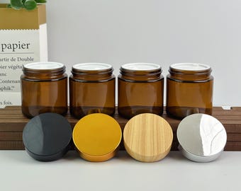 Tarros de crema de vidrio ámbar rellenables de 100 g, con múltiples opciones de tapa (plástico imitación madera, negro, dorado, plateado), envases para el cuidado de la piel y cosméticos.