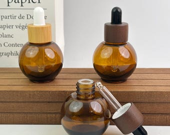 Frascos cuentagotas de vidrio ámbar de 30 ml con tapa de madera o bambú, frascos recargables para tinturas de aceites esenciales, sérums y mezclas caseras para el cuidado de la piel.