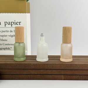 Set of pastel frosted glass bottles (bamboo caps) – compact sizes for travel aromatherapy or homemade skincare storage