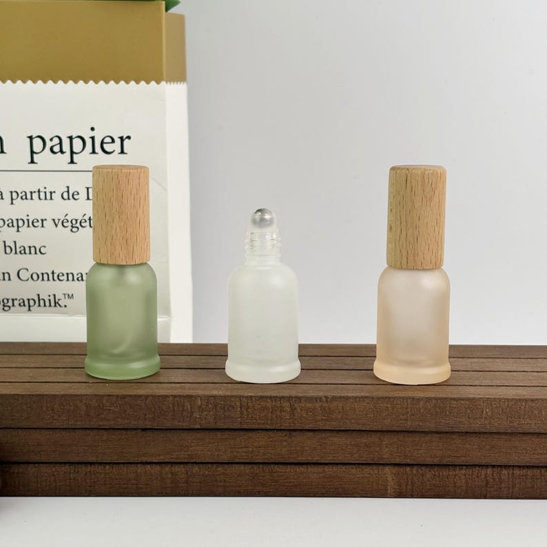 Set of pastel frosted glass bottles (bamboo caps) – compact sizes for travel aromatherapy or homemade skincare storage