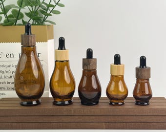 Bernsteinfarbene Teardrop Glas-Tropfflaschen mit Bambus / Holz-Deckeln - Augentropfen in fünf Größen für Hautpflege, ätherische Öle & DIY-Schönheit, Reisegröße