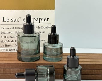 Frascos goteros de vidrio minimalistas, envases rellenables para aceites de perfume y sueros, ideales para cosméticos caseros, aromaterapia y cuidado de la piel sistemático.