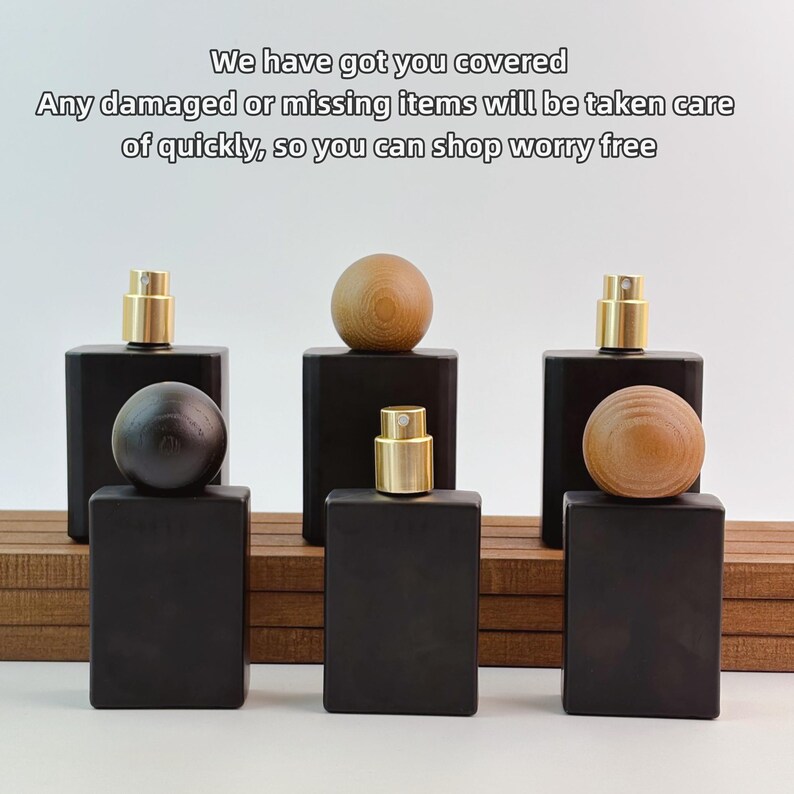 May include: Black rectangular perfume bottles with gold-colored spray tops and wooden sphere stoppers. The image includes the text "We have got you covered. Any damaged or missing items will be taken care of quickly, so you can shop worry free."