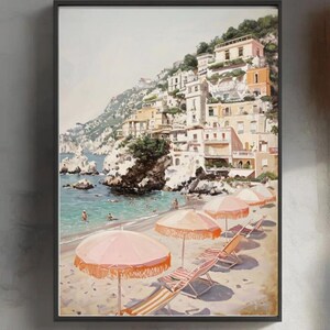 May include: A painting depicting a beach scene with colourful buildings on a cliffside. The beach features pink umbrellas and striped deckchairs. The water is blue and there are people swimming in the distance.