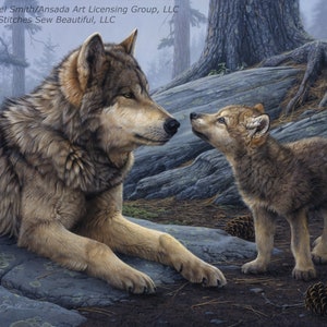 May include: A gray wolf with brown fur sits on a rock in a forest setting. A smaller gray wolf pup with brown fur stands in front of the wolf, looking up at it. The background is a blurry forest scene with trees and fog.