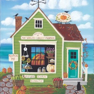 May include: A green building with a sign that reads "Home of the World's Largest Pumpkin" and "The Pumpkin Patch". The building has a window display with pumpkins, pies, and other fall items. There is a black cat sitting on the sidewalk in front of the building.