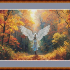 May include: Framed artwork depicting an angel with large white wings in a forest setting. The angel is facing the viewer, with a bright light shining behind it. The trees are filled with autumn colors, creating a warm and inviting scene.