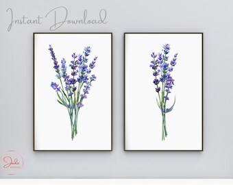 Könnte beinhalten: Zwei gerahmte Drucke von Aquarellmalereien von Lavendelblüten auf weißem Hintergrund. Die Drucke sind in schwarzen Rahmen und hängen an einer weißen Wand.