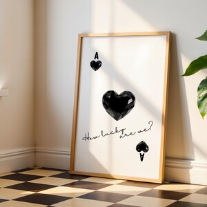May include: A black and white printable art print with a stylized image of the Ace of Spades playing card. The text "How lucky are we?" is written in cursive below the card.