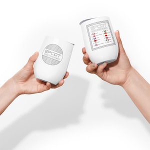 May include: Two white insulated wine tumblers with the text "EPCOT" in grey. One tumbler features a geometric design, the other has a list of flags. The tumblers are held up against a white background.