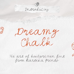 May include: White paper background with orange handwritten text that reads "Dreamy Chalk". The text "Introducing" is above the main text. Two orange bow illustrations flank the main text. The text "The art of handwritten font from Kartika prints" is below.