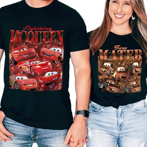 May include: Black t-shirts featuring characters from the animated movie Cars. One shirt displays Lightning McQueen with the text "Lightning McQueen". The other shirt shows Tow Mater with the text "Tow Mater".