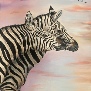 May include: Two zebras stand side-by-side, their black and white stripes blending together. The zebras are facing to the right, with the zebra in the back looking over the shoulder of the zebra in front. The background is a soft, pink and purple sky with a flock of birds flying overhead.