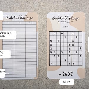 May include: Two Sudoku challenge cards with a brown and white abstract design. The card on the left has a blank grid for solving Sudoku puzzles. The card on the right has a completed Sudoku puzzle with the numbers 1 through 9. The card on the right also has the text "Sudoku Challenge" and "Mittel" (German for "medium"). The cards are 8.3 cm wide and 14.5 cm tall.