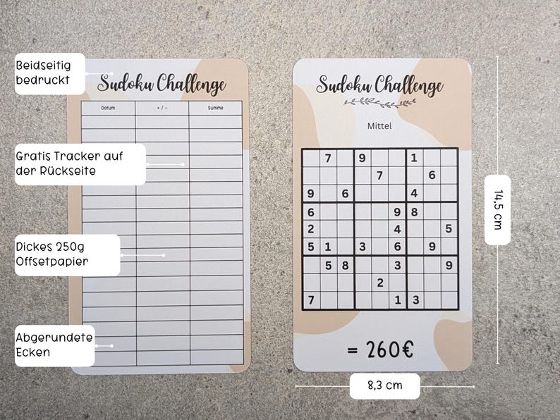 May include: Two Sudoku challenge cards with a brown and white abstract design. The card on the left has a blank grid for solving Sudoku puzzles. The card on the right has a completed Sudoku puzzle with the numbers 1 through 9. The card on the right also has the text "Sudoku Challenge" and "Mittel" (German for "medium"). The cards are 8.3 cm wide and 14.5 cm tall.