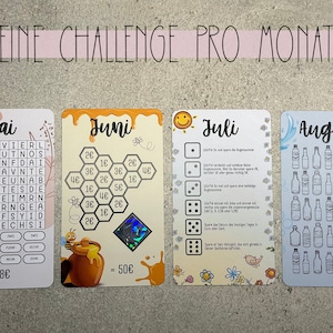 May include: Four colourful cards with the months of May, June, July, and August. Each card has a different challenge for the month. The May card has a word search puzzle. The June card has a honeycomb with numbers. The July card has a dice game. The August card has a picture of water bottles.