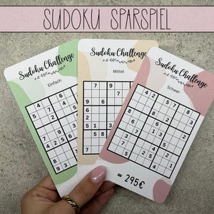 May include: Three Sudoku puzzle cards with different difficulty levels: Easy, Medium, and Hard. The cards are pink and green with a floral design and the text "Sudoku Challenge".
