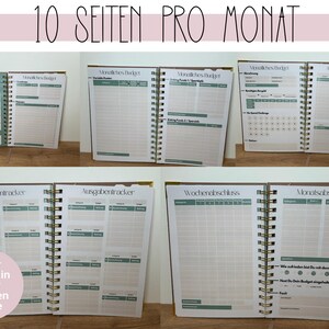 May include: A spiral-bound planner with pages featuring monthly budget, expense tracker, and weekly/monthly summary sections. The planner has a gold spiral binding and includes the text "10 SEITEN PRO MONAT" at the top. Each month is a different color.
