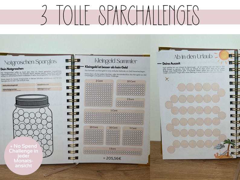 May include: A spiral-bound notebook with three different savings challenges. The first page shows a jar graphic for saving, the second has coin-saving charts, and the third has a vacation-themed chart. The notebook has the text "3 TOLLE SPARCHALLENGES".