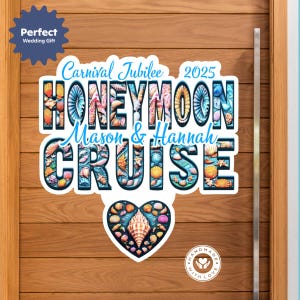 May include: A white and blue sign with the text "Carnival Jubilee 2025 Honeymoon Cruise Mason & Hannah" in a decorative font with seashells and ocean-themed imagery. A heart-shaped design with seashells is below the text. The sign has a "Handmade with Love" sticker in the bottom right corner.