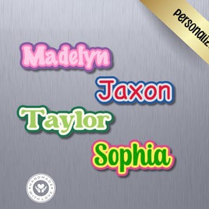May include: Four custom name decals featuring the names Madelyn in pink, Jaxon in red, Taylor in light green, and Sophia in bright green. Each name has a thick, rounded, multi-colored border. A gold banner in the corner reads personalized.