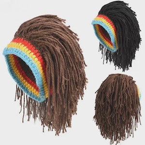 May include: Three crochet dreadlock hats in brown and black. Each hat features a colorful band with blue, yellow, and red stripes. The dreadlocks hang down from the hat, creating a unique and stylish look. The hats are displayed against a light background.