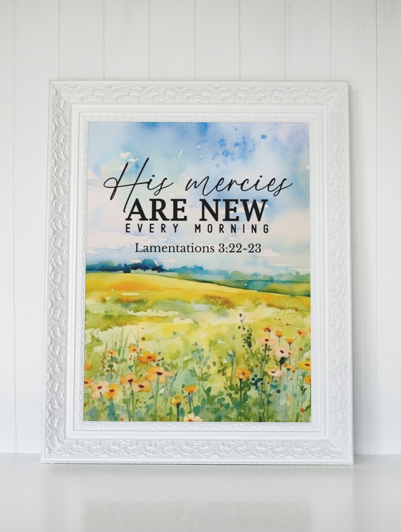 May include: A watercolor painting of a field of wildflowers with a blue sky in the background. The text "His mercies are new every morning" is written in black on a white background. The text "Lamentations 3:22-23" is written in black below the main text.