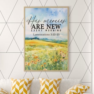 May include: A watercolor painting of a field of flowers with a blue sky in the background. The text "His mercies are new every morning" and "Lamentations 3:22-23" is printed on the painting.