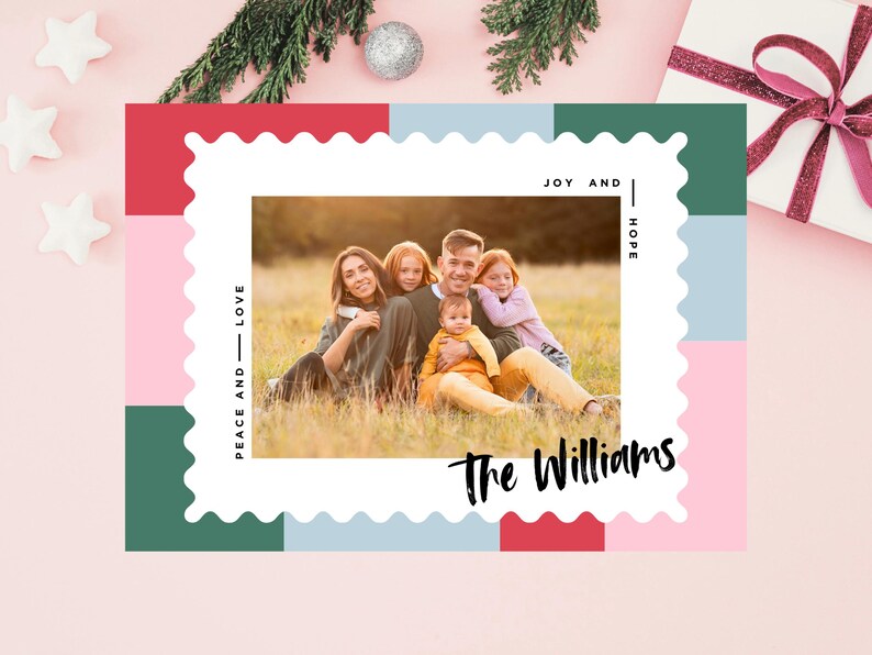 May include: A Christmas card with a photo of a family of five in a field. The card has a colorful background with the words "Peace and Love", "Joy and Hope", and "The Williams".