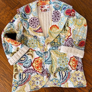 May include: A rustic wooden sign with the text "Welcome to our porch" in white lettering. The sign features a distressed finish and a simple, inviting design, perfect for outdoor decor.