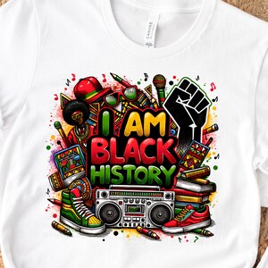 May include: White t-shirt with a colorful graphic design featuring the text "I AM BLACK HISTORY". The design includes a raised fist, musical notes, books, a boombox, and other objects.