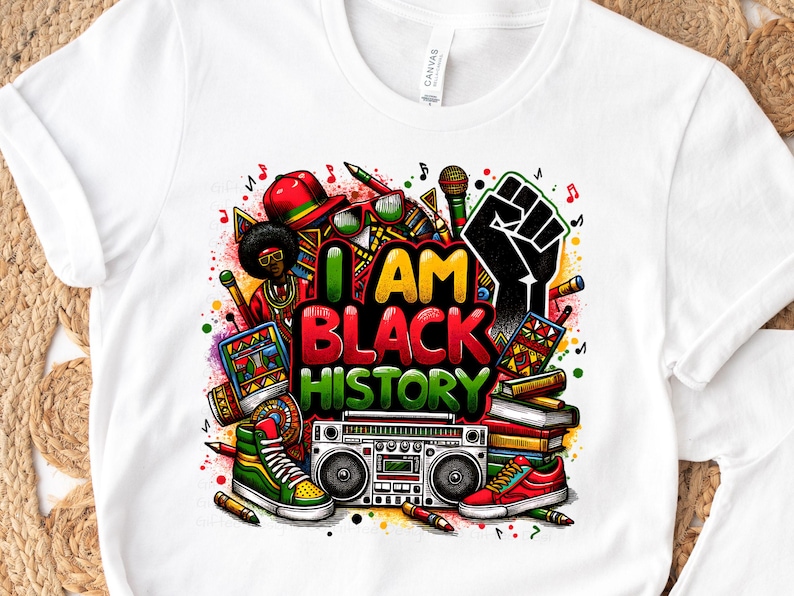 May include: White t-shirt with a colorful graphic design featuring the text "I AM BLACK HISTORY". The design includes a raised fist, musical notes, books, a boombox, and other objects.