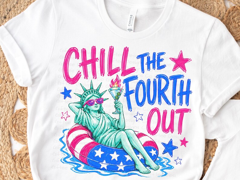 May include: A white t-shirt featuring a graphic of the Statue of Liberty wearing pink sunglasses, lounging in a red, white, and blue star-patterned pool float while holding a martini glass. The text reads CHILL THE FOURTH OUT in pink and blue.