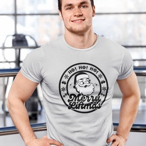 May include: A white t-shirt with a black and white graphic of Santa Claus with the text "Ho! Ho! Ho! Merry Liftmas!"