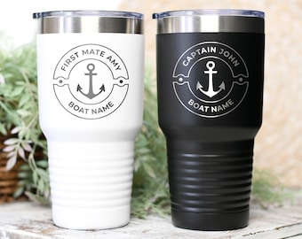 May include: Two stainless steel tumblers with a white and black finish. The tumblers feature a nautical design with an anchor and the text "First Mate Amy" and "Captain John".